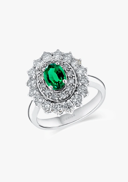 ELIZABETH 18K white gold with brilliant cut diamonds crowned by a colombian emerald