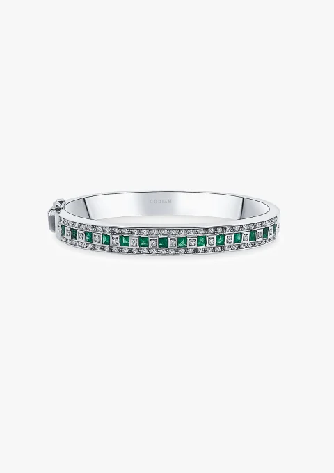 MORRIÑA 18K white gold bangle with diamonds and emeralds.
