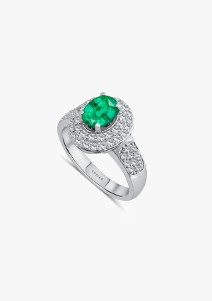 LEILONIE 18K white gold with brilliant cut pave diamonds crowned by an oval cut emerald ring