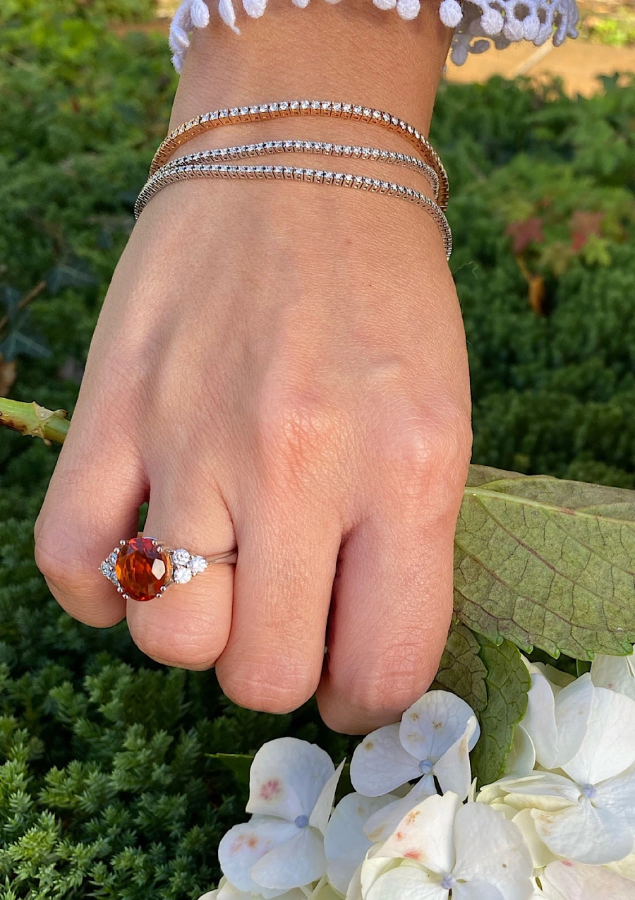 GALILEA 18K white gold ring with diamonds and orange topaz.