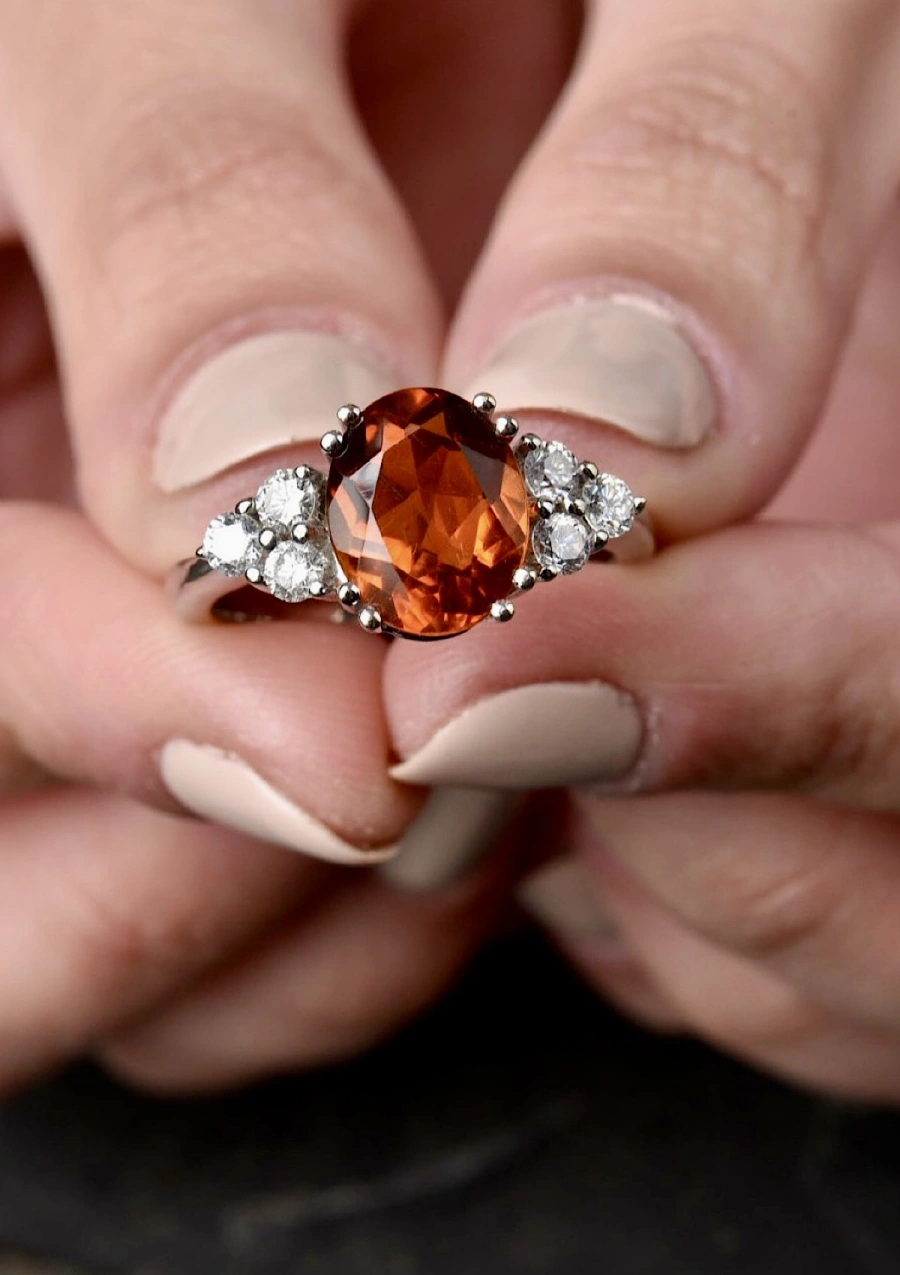 GALILEA 18K white gold ring with diamonds and orange topaz.