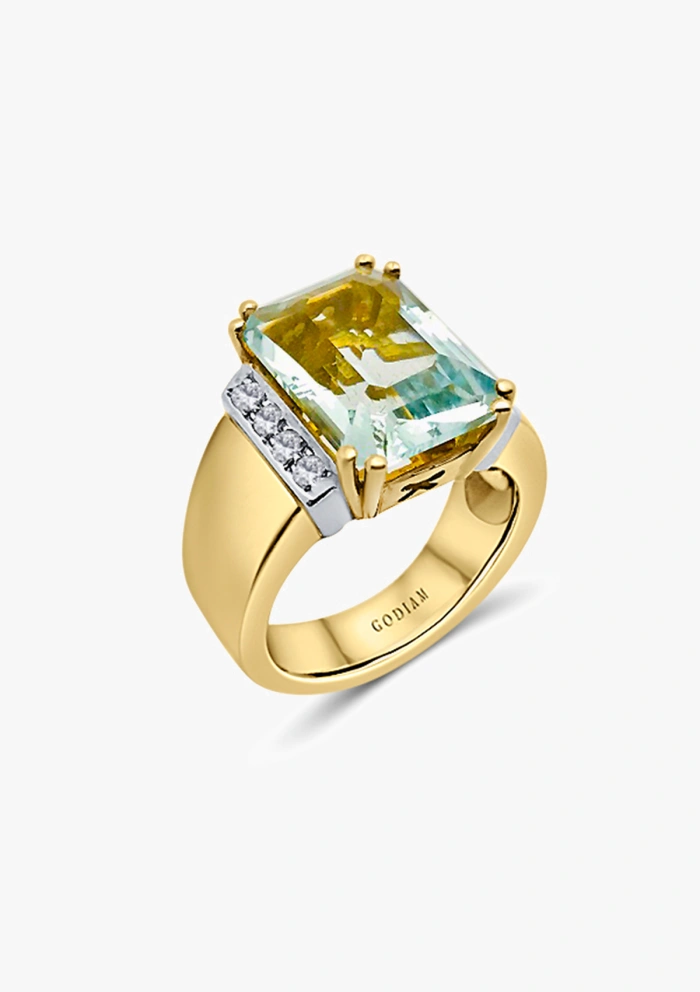 Anillo CALMA en oro amarillo-blanco de 18K con diamantes y aguamarina|Anillos con Aguamarinas|Godiam Alta Joyería Anillo CALMA en oro amarillo-blanco de 18K con diamantes y aguamarina|Anillos con Aguamarinas|Godiam Alta Joyería