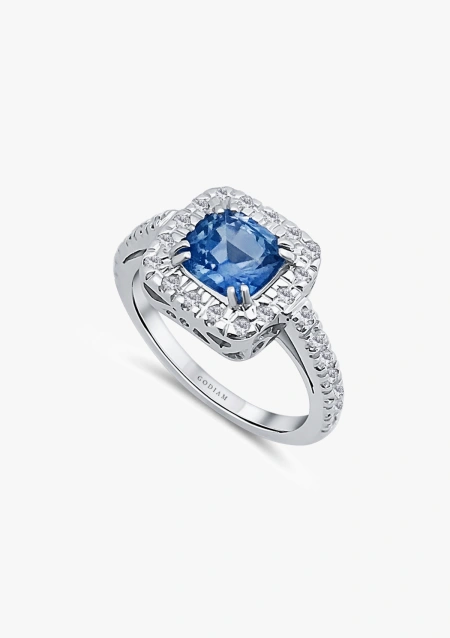 MYANMAR 18K white gold with brilliant cut diamonds crowned by a cushion cut blue sapphire ring