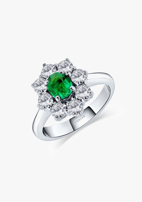 SIMONETA 18K white gold ring with a rosette of brilliant cut diamonds rosette crowned with an oval cut colombian emerald