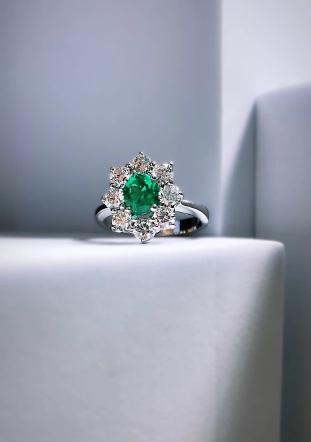 SIMONETA 18K white gold diamond and emerald rosette ring.