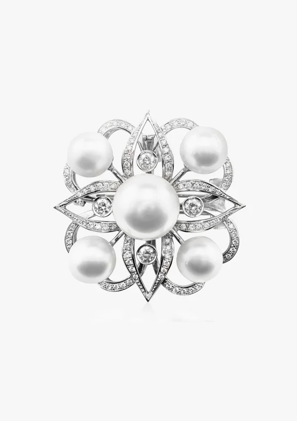 Broche TIARÉ en or blanc 18K avec diamants et perles.
