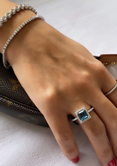 LUCÍA 18K white gold diamonds and London Blue topaz ring.