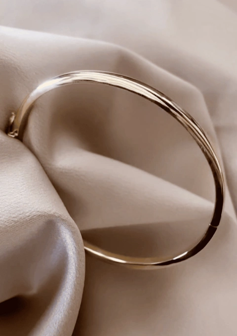 SQUARE section 18K gold stackable bangle.