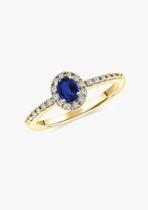 OVAL BLUE 18K gold ring with a halo of brilliant cut diamonds crowned by an oval cut blue sapphire