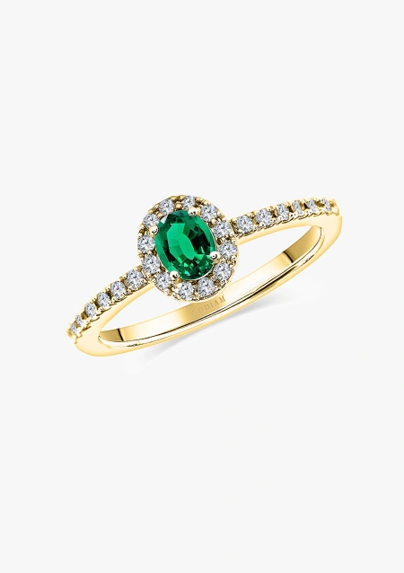 OVAL GREEN ring in 18K gold with brilliant cut diamonds halo crowned by an oval cut emerald