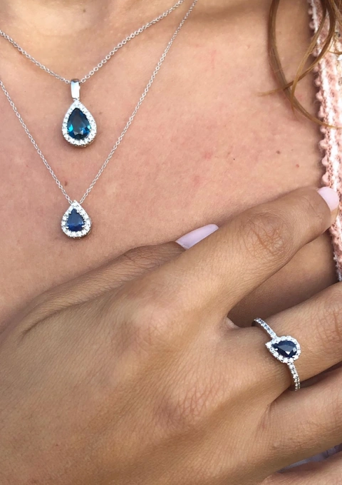 BLUE LAGOON 18K white gold diamond and LB topaz pendant.