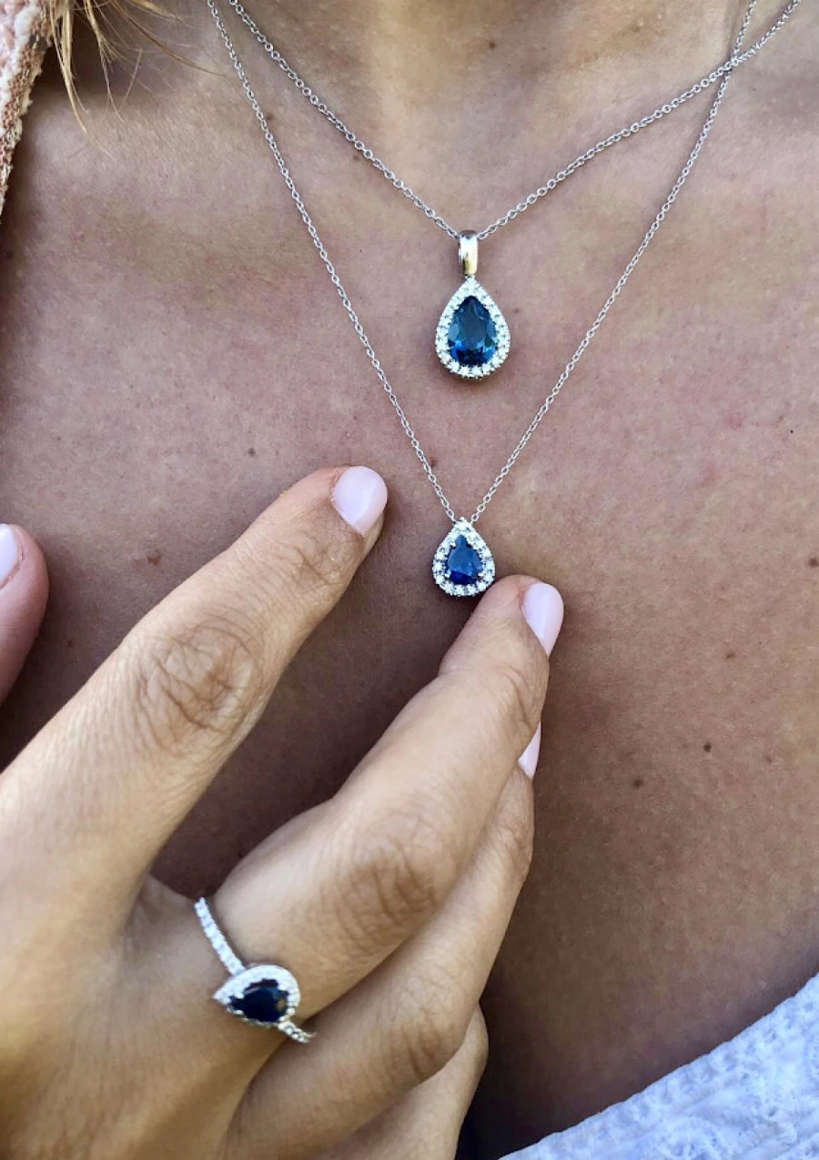 BLUE LAGOON 18K white gold diamond and LB topaz pendant.