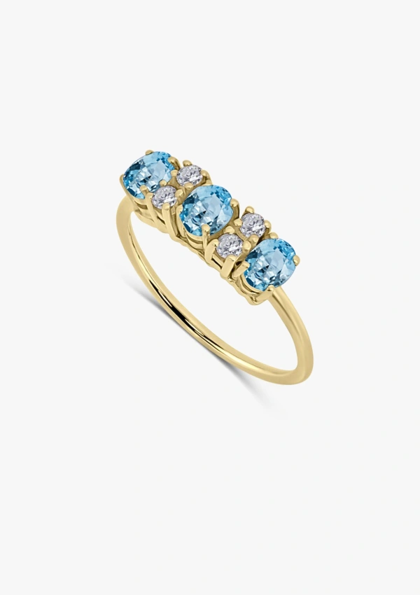 Anillo LAURA en oro amarillo de 18K con diamantes talla brillante y aguamarinas talla oval