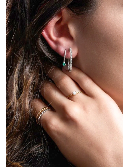 Bague TWISTY en or jaune 18K et diamant taille brillant.