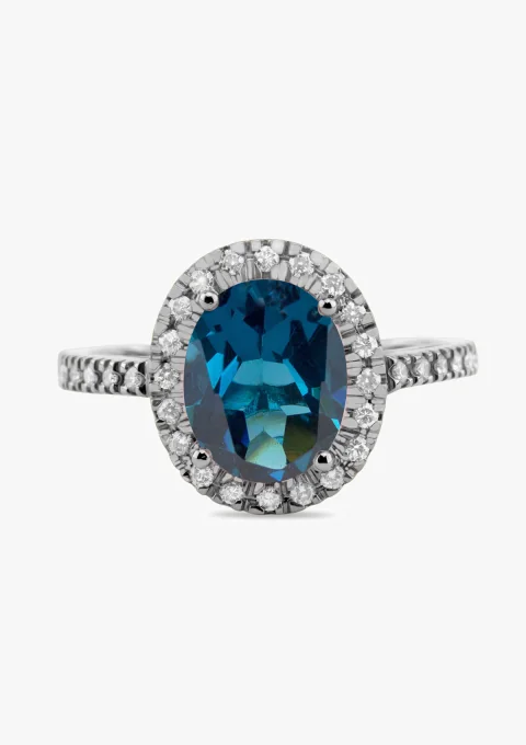 Anel ELSA em ouro branco 18K com diamantes e topázio.