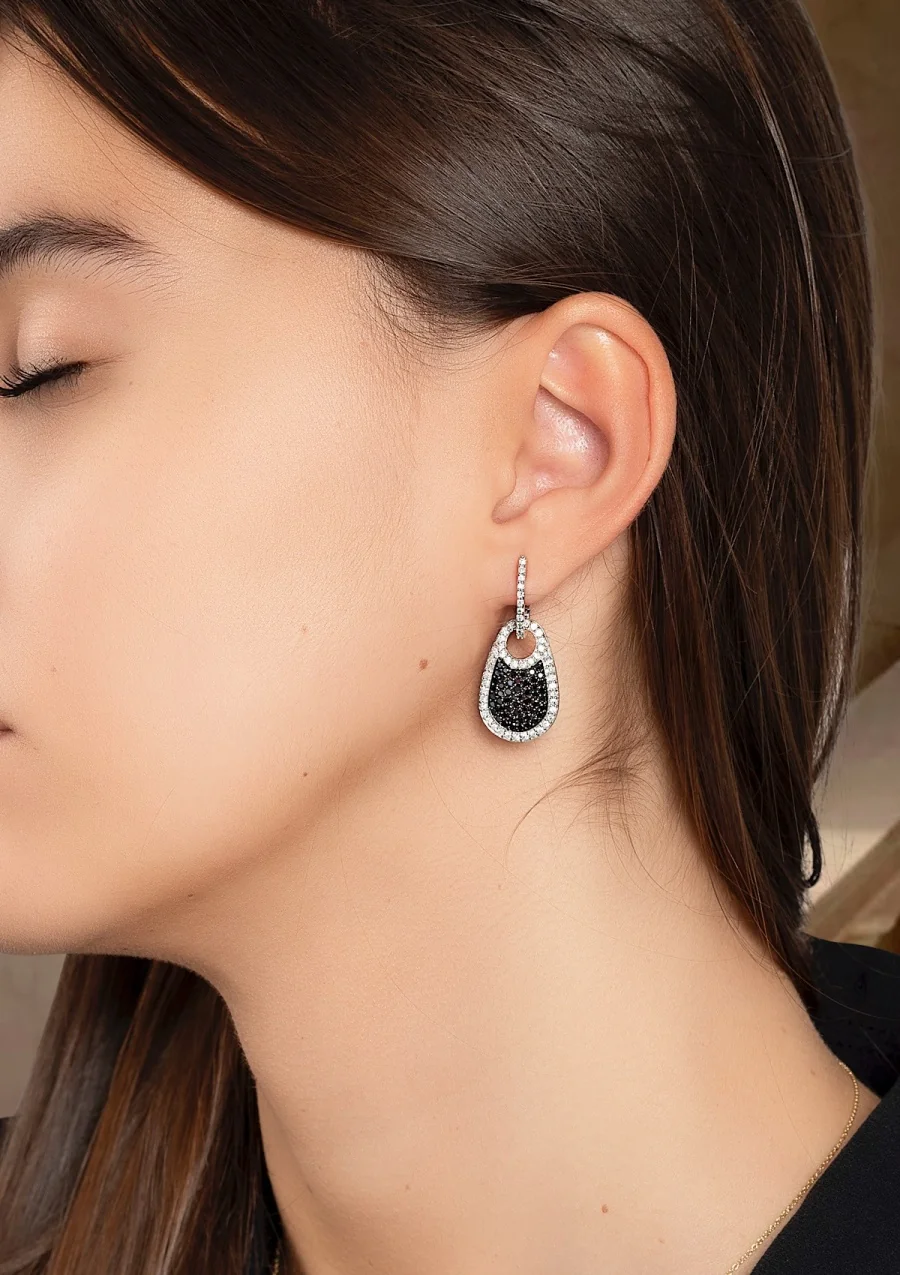 CELINE 18K white gold black and white pave diamond earrings.